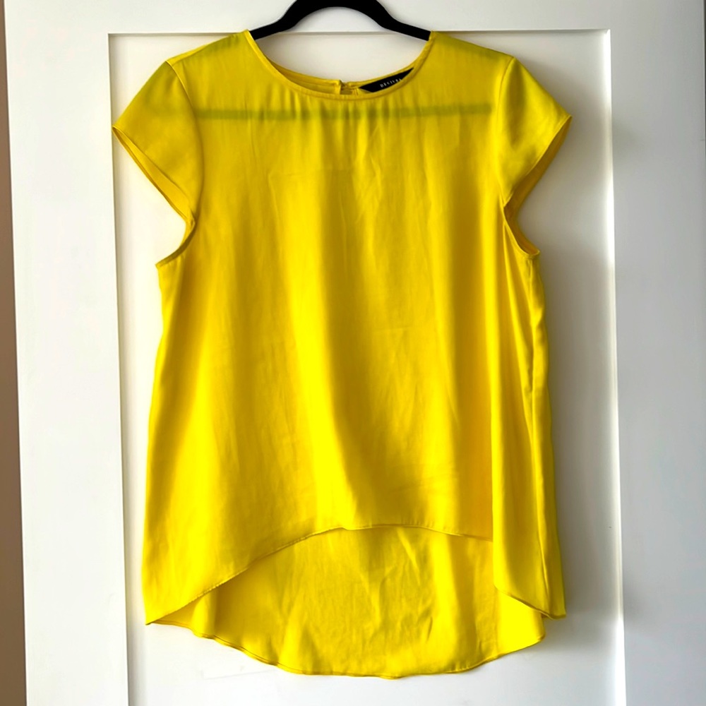 Decjuba stylish yellow top! Always made an entrance when wore with a black suit!
